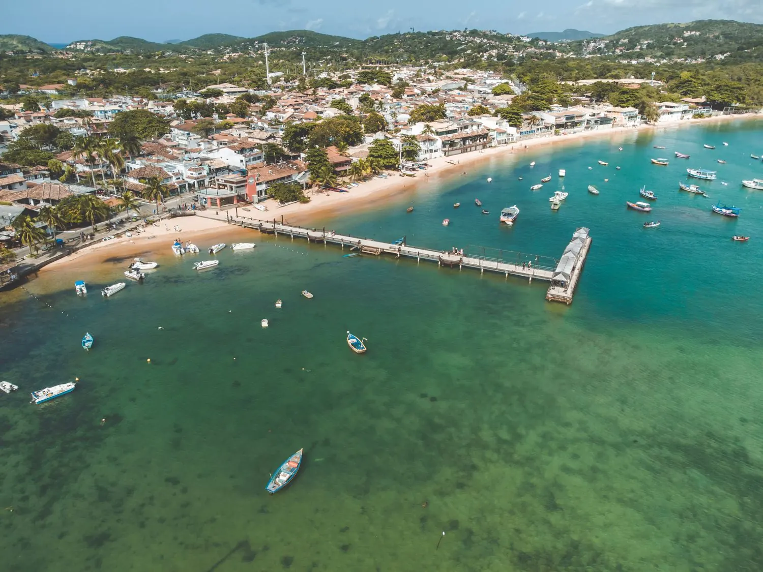 Aerial view of the pier and turquoise coastline at Armação dos Búzios, the beach town this guide covers.