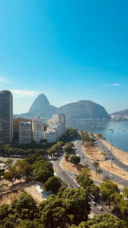 Aerial view of Rio de Janeiro with Sugarloaf Mountain and coastline on a clear day — the kind of everyday tourist scene that defines travel to Brazil in 2026.