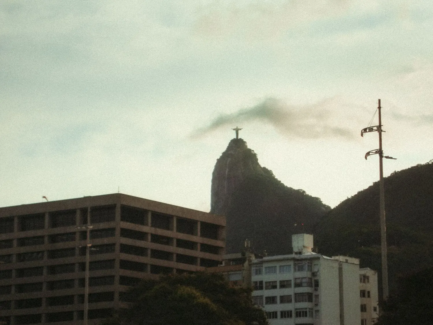 Christ the Redeemer on Corcovado Mountain overlooking the Rio de Janeiro skyline.