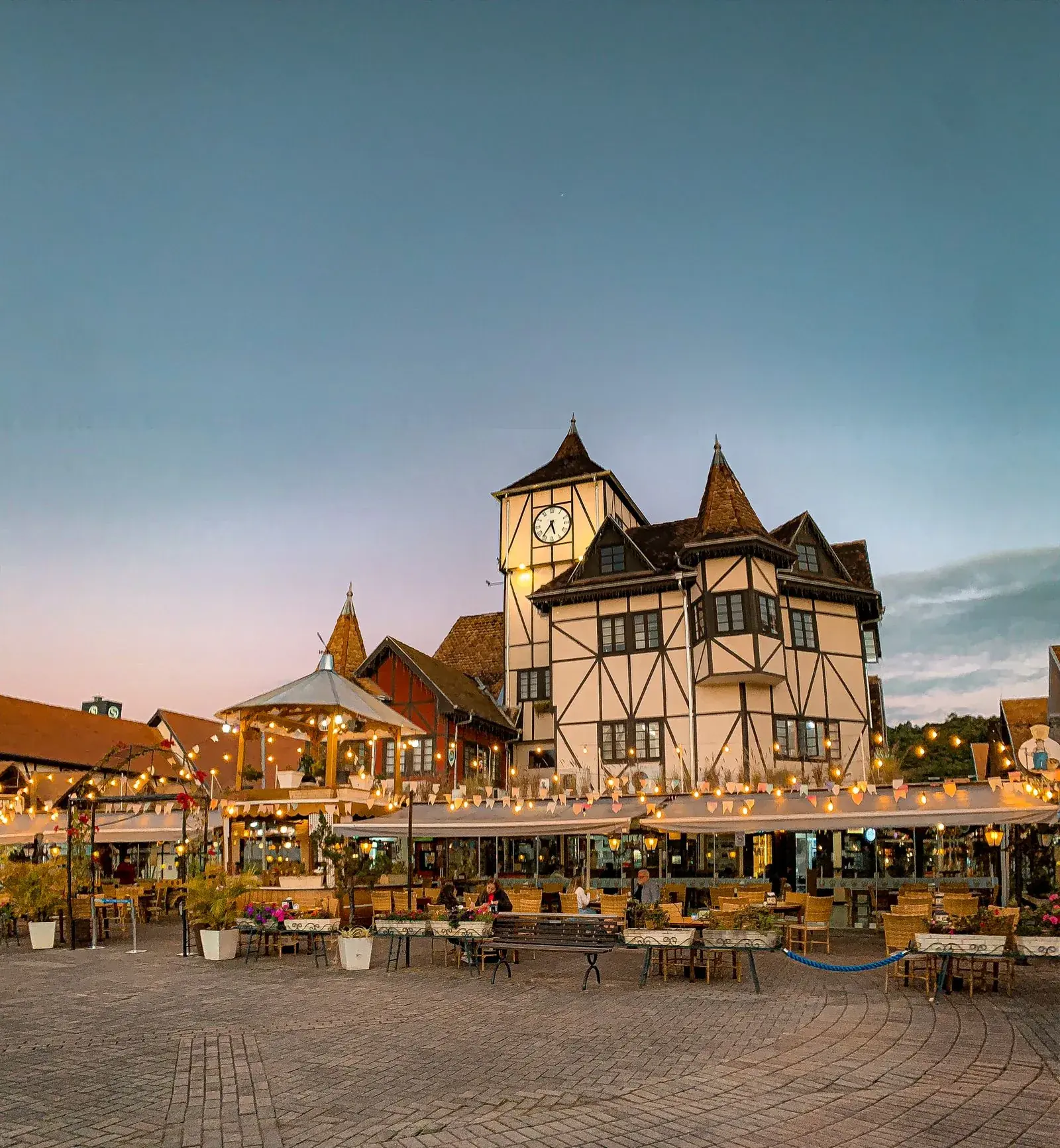 European-style park setting in southern Brazil with ornamental landscaping and classic architecture.