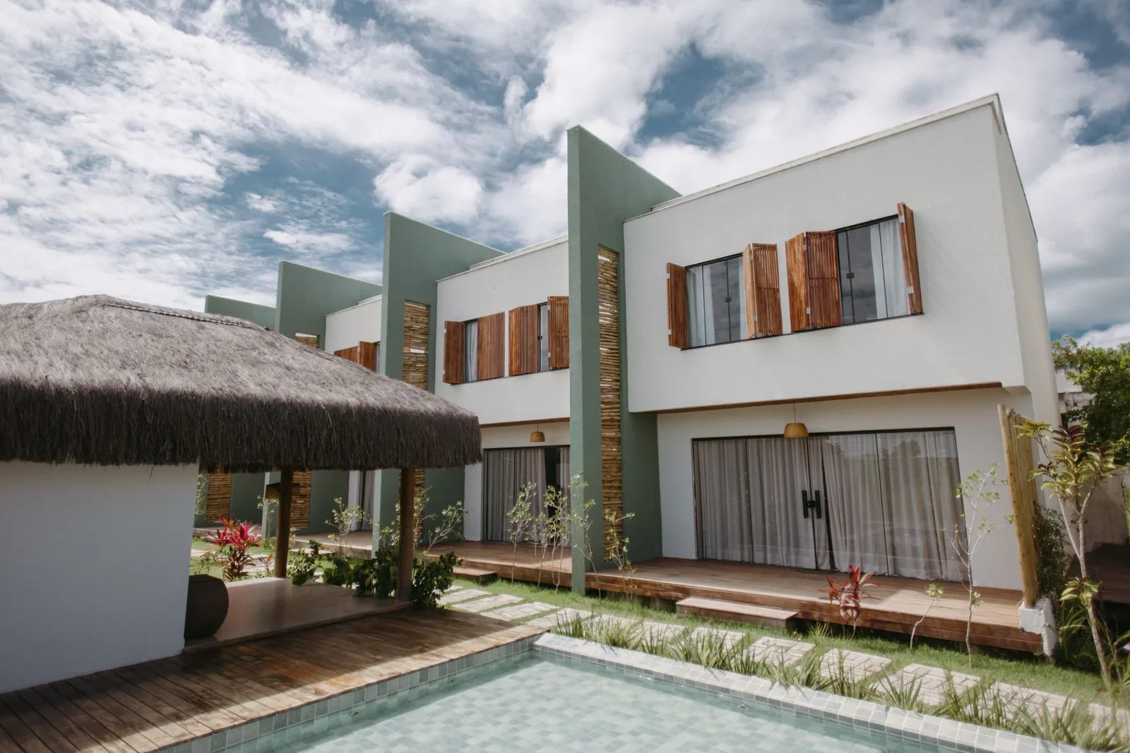 Modern tropical villas with a pool in Bahia, Brazil, setting an aspirational travel-planning mood.