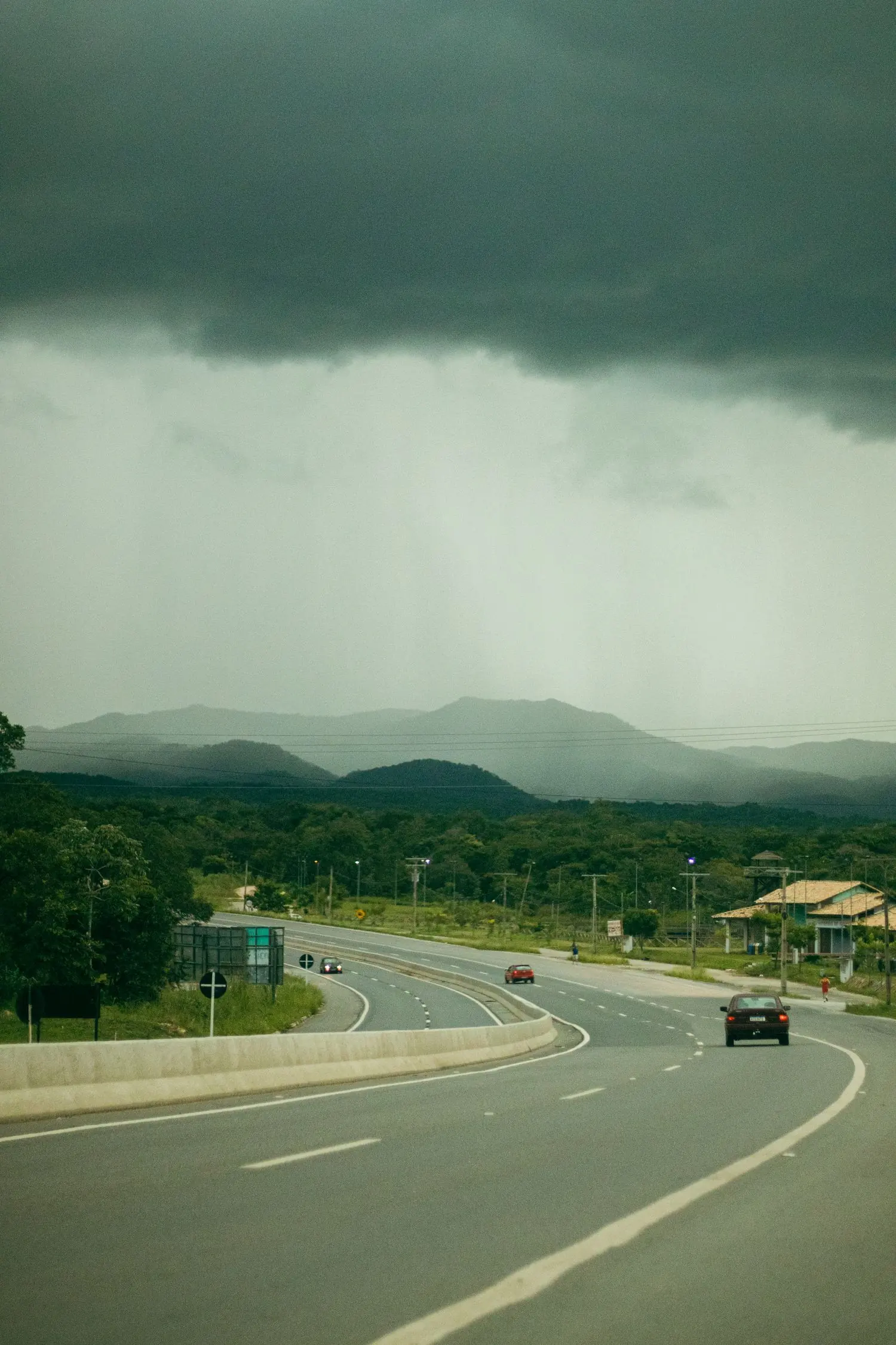 A winding rural highway in Goiás under a stormy sky, the kind of road conditions this guide describes.